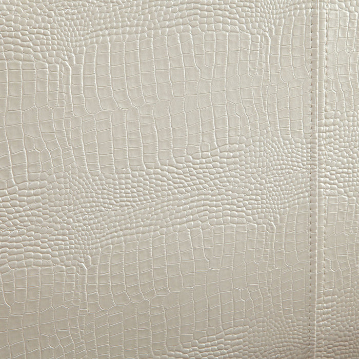 Detail shot of the pearl white faux crocodile leather upholstery.