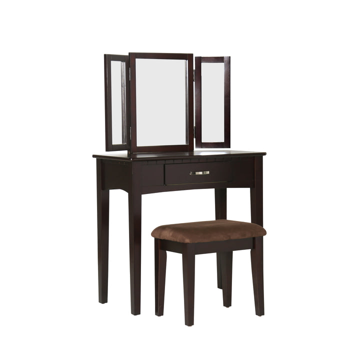 Right-angled espresso vanity set against a white background. A tri-fold mirror, drawer with silver bar pull, and microfiber upholstered seat sit on tapered legs.