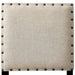 Front-facing detail shot of the beige faabric square chair back with nailhead trim.