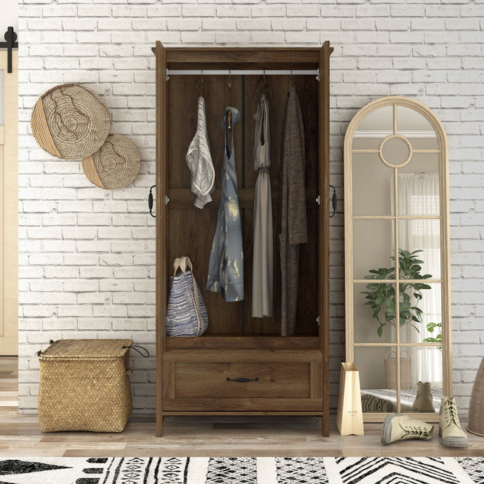 Front-facing tall wardrobe cabinet with one drawer and two open doors in a medium distressed walnut finish in a casual bedroom with accessories