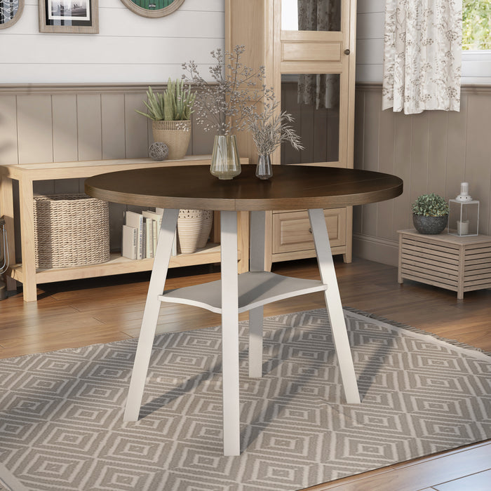 Right-angled rustic wood drop-leaf dining table with a wood finish top and white base in a casual breakfast nook with accessories