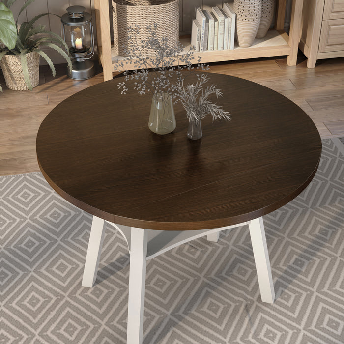 Top view rustic wood drop-leaf dining table with a wood finish top and white base in a casual breakfast nook with accessories
