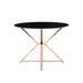 Front-facing modern glam dining table with a two-tone black and gold finish and bold, geometric base on a white background