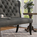 Left-angled close up ambrosia transitional gray nailhead trim fabric loveseat dining bench in a living room with accessories