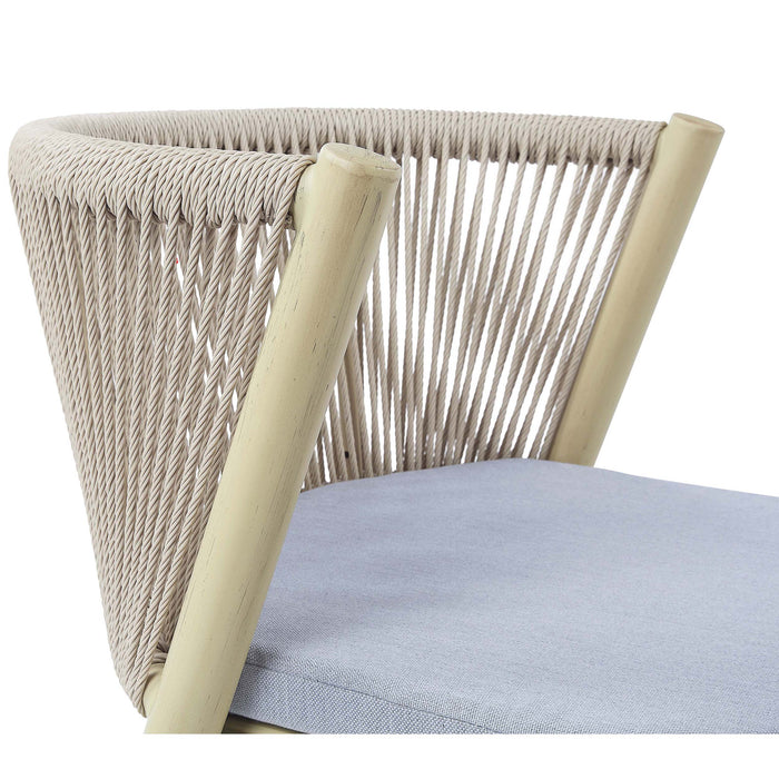 Right-facing transitional aluminum patio dining chair in natural tone finish displaying faux wicker rope backing and padded blue seat cushion on a white background.