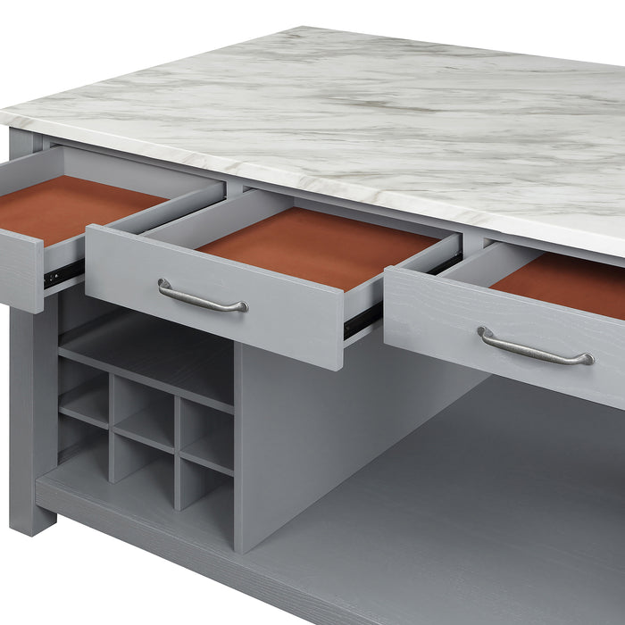 Close-up detail view of open drawers and white marble-like tabletop on a farmhouse light gray counter height table on a white background