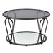 Front-facing modern round black nickel coffee table with open teardrop shape steel legs, a gray tempered glass top, and mirror open bottom shelf on a white background.