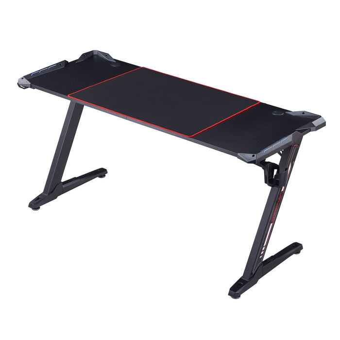 Left angled contemporary black gaming desk with red accents on a white background