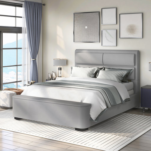 Left-angled modern glam gray upholstered bed in a stylish bedroom with linens and accessories