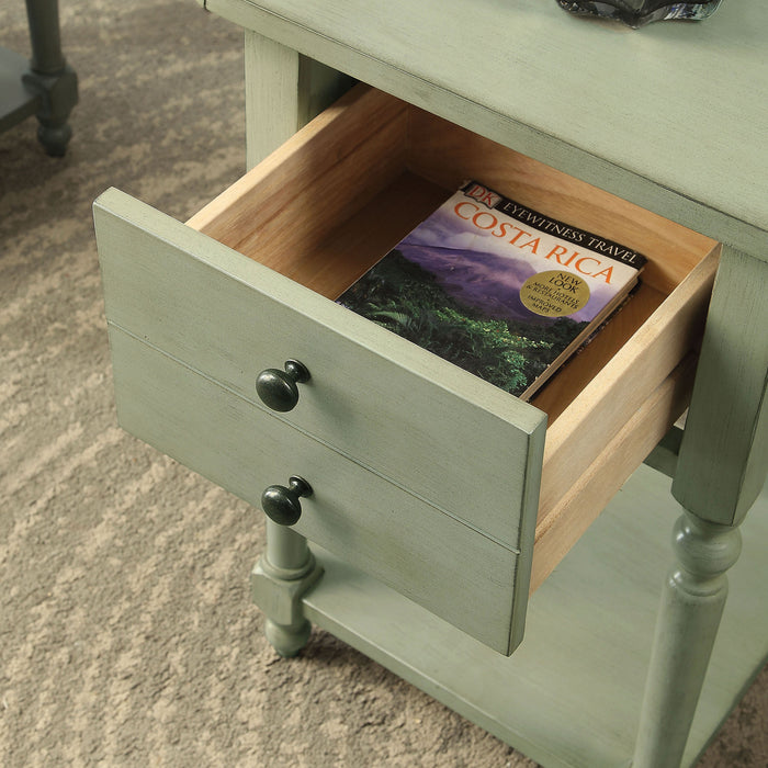  Angled left-facing antique gray one-drawer double drop-leaf side table with drawer open in a living area with accessories
