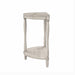 Side view demi-lune accent table in an antique white finish with turned legs on a white background
