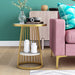 Front facing contemporary white faux marble and gold one-shelf round side table in a living room with accessories