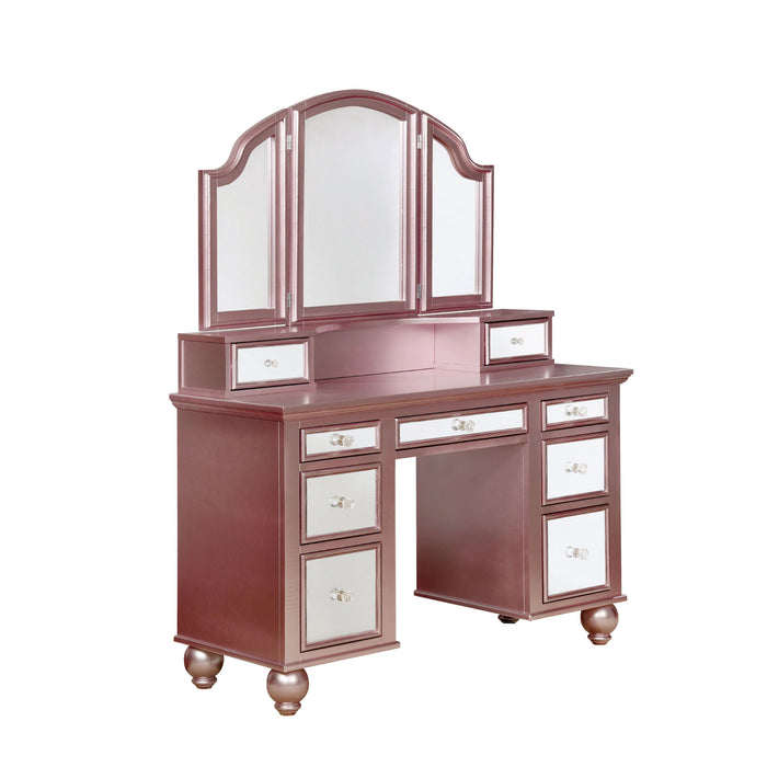 Right-angled rose gold vanity table against a white background. This vanity table offers a tri-fold mirror and a total of nine mirrored drawers with acrylic knobs.