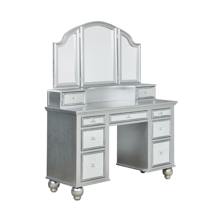 Right-angled silver vanity table against a white background. This vanity table offers a tri-fold mirror and a total of nine mirrored drawers with acrylic knobs.