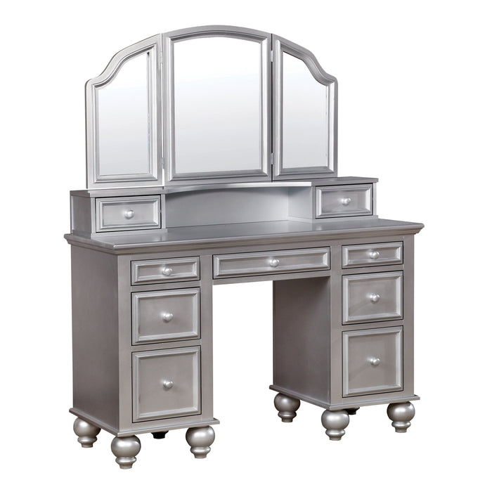 Right-angled silver vanity table against a white background. This vanity table offers a tri-fold mirror and a total of nine drawers.