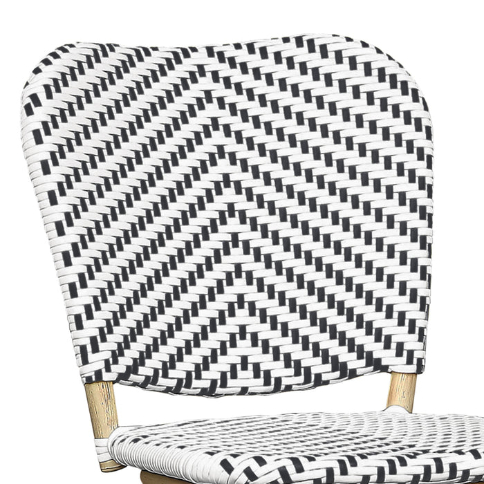 Detail shot of a black and white chevron patterned wicker curved backrest.