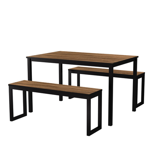 Left angled walnut and black three piece dining table set with benches on a white background
