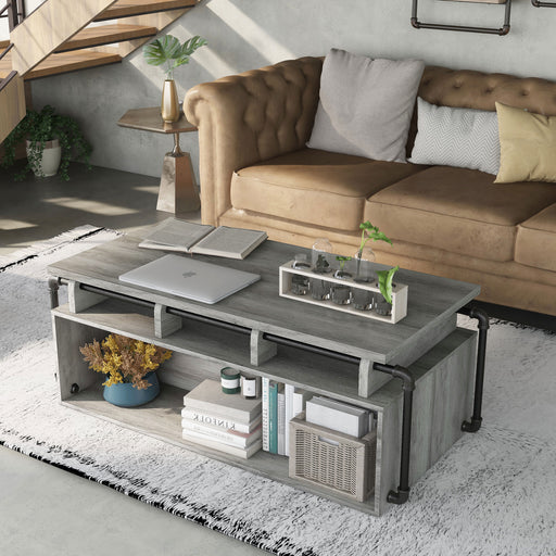 Left angled industrial vintage gray oak lift-top coffee table with shelves in a living room with accessories