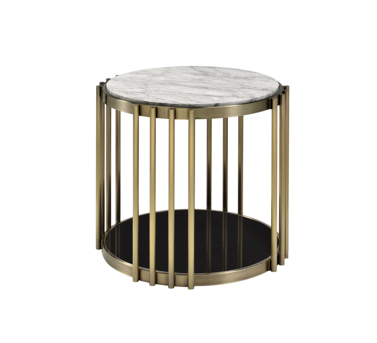 Drum side table against a white background. Faux white marble tabletop and black glass base shelf sandwich an antique brass frame.