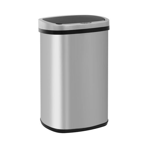 Right facing contemporary silver stainless steel touch free trash can on a white background