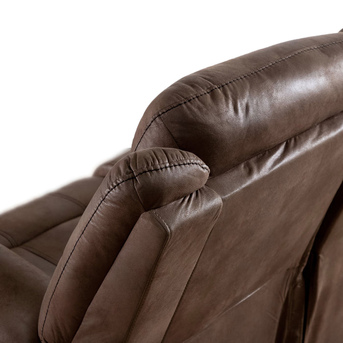 Left facing close up back view of the backrest of a transitional brown microfiber recliner with accent stitching on a white background