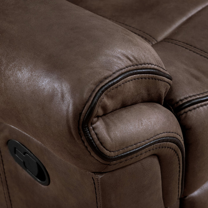 Right facing close up of the armrest of a transitional brown microfiber recliner with accent stitching on a white background