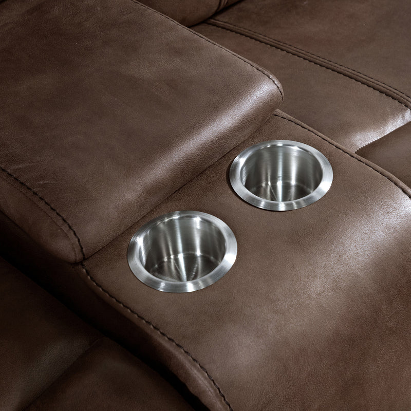 Right facing close up of the console and cupholders of a transitional brown microfiber reclining loveseat with console and accent stitching on a white background