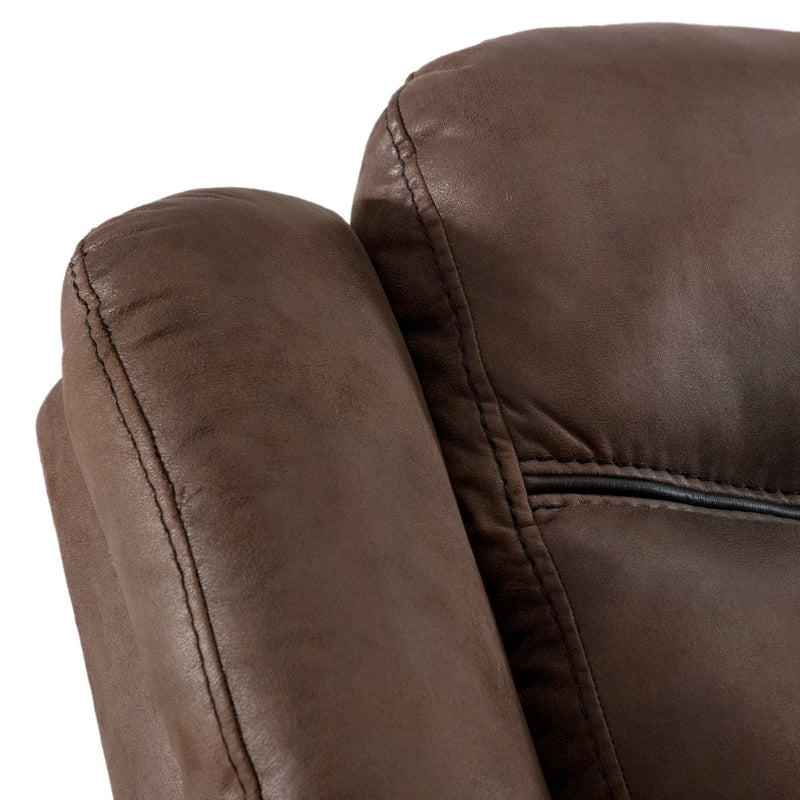 Right facing close up of the backrest of a transitional brown microfiber reclining sofa with accent stitching on a white background