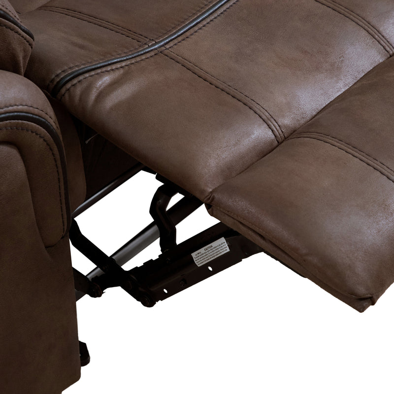 Right facing close up of the raised leg rest of a transitional brown microfiber reclining sofa with accent stitching on a white background