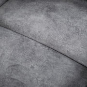 Close up of the upholstery fabric of a transitional grey microfiber sofa with accent piping