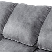 Left facing close up of the back cushion of a transitional grey microfiber sofa with accent piping on a white background