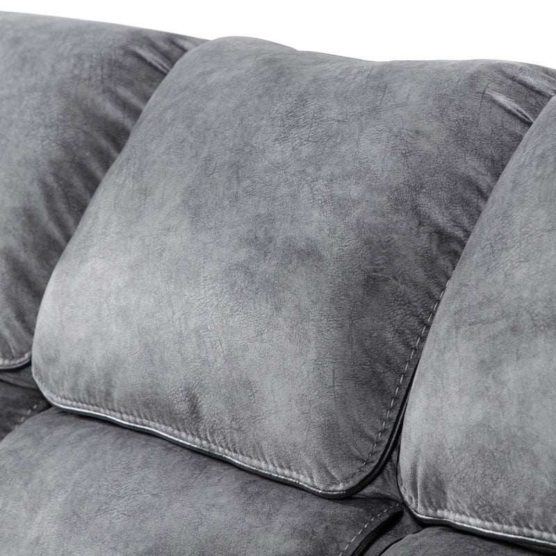 Left facing close up of the back cushion of a transitional grey microfiber sofa with accent piping on a white background