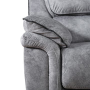 Front facing close up of the armrest of a transitional grey microfiber sofa with accent piping on a white background