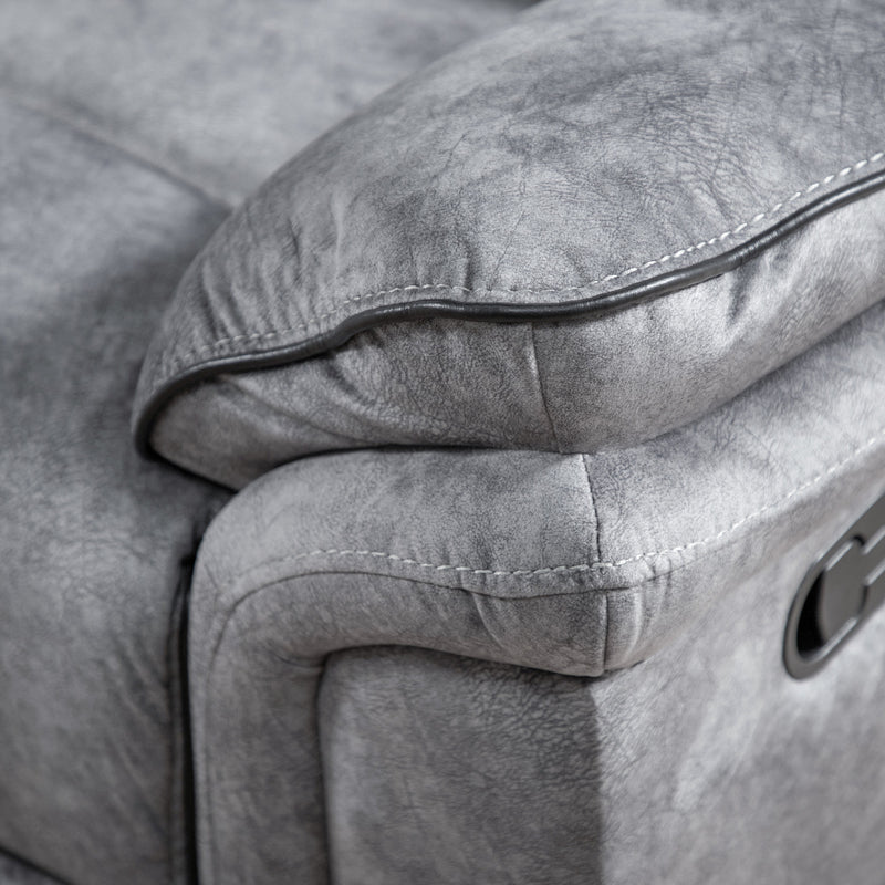 Left facing close up of the armrest of a transitional grey microfiber sofa with accent piping