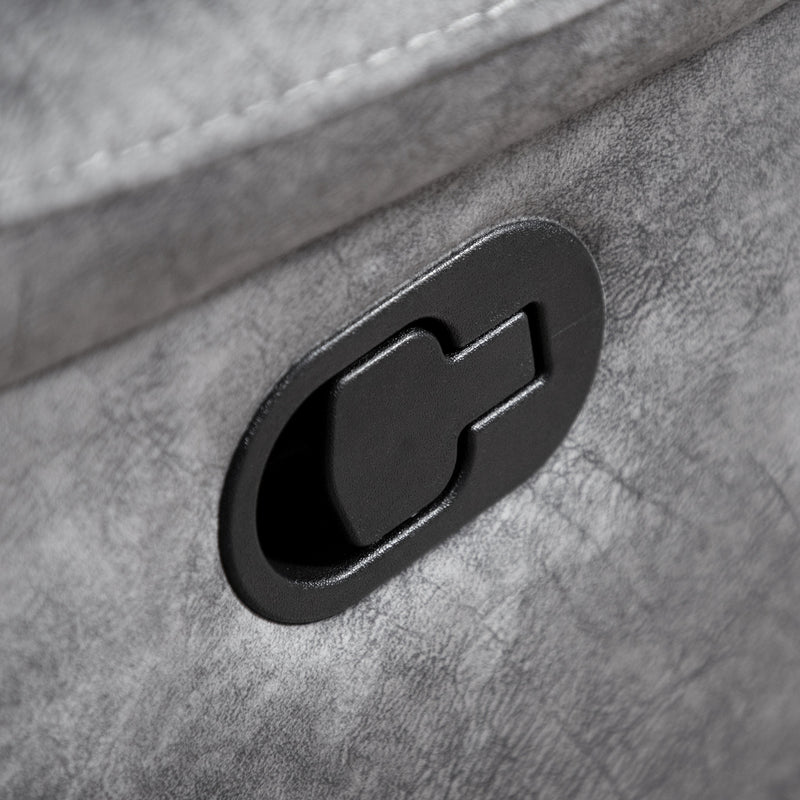 Left facing close up of the recline lever of a transitional grey microfiber sofa with accent piping