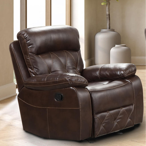 Right facing transitional brown faux leather recliner with diamond stitching in a room with accessories