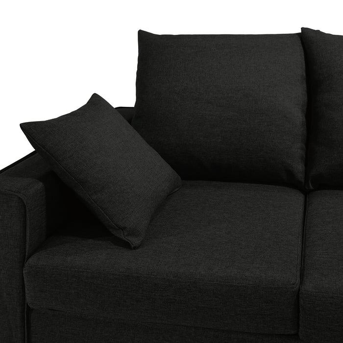 Left facing close up of the armrest of a transitional black customizable sectional sofa on a white background