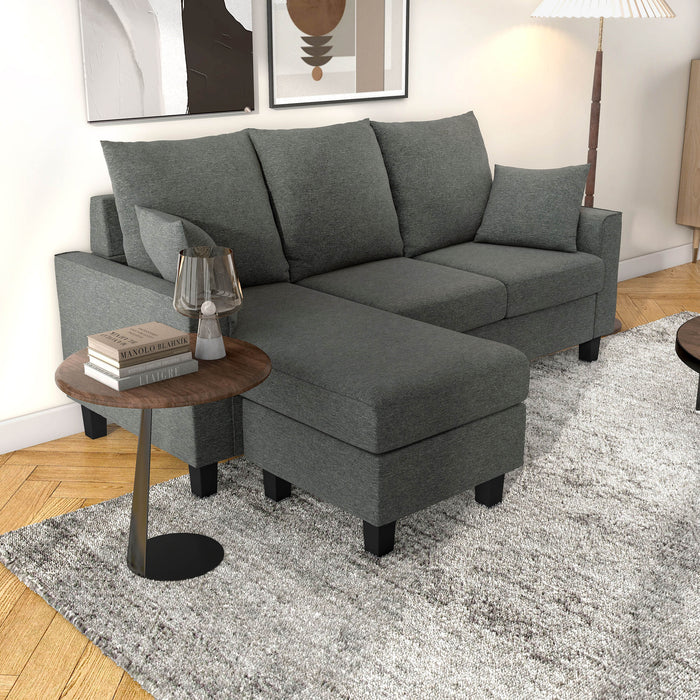 Right facing transitional dark grey customizable sectional sofa in a room with accessories