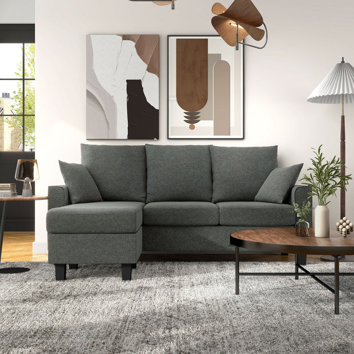 Front facing transitional dark grey customizable sectional sofa in a room with accessories