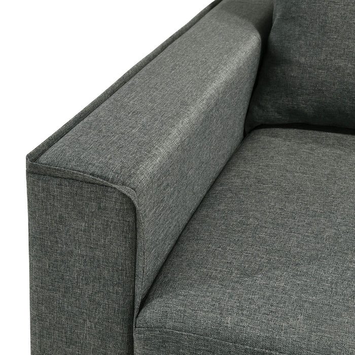Left facing close up of the armrest of a transitional dark grey customizable sectional sofa on a white background