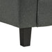 Left facing close up of the leg of a transitional dark grey customizable sectional sofa on a white background