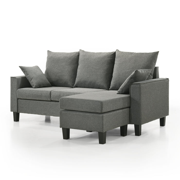 Left facing contemporary grey sectional sofa with an adjustable ottoman on a white background