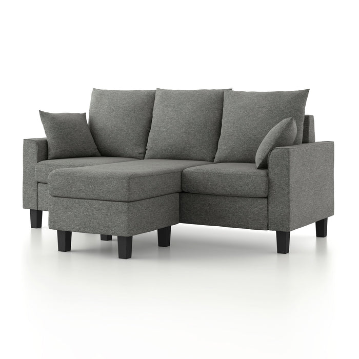 Left facing contemporary grey sectional sofa with an adjustable ottoman on a white background