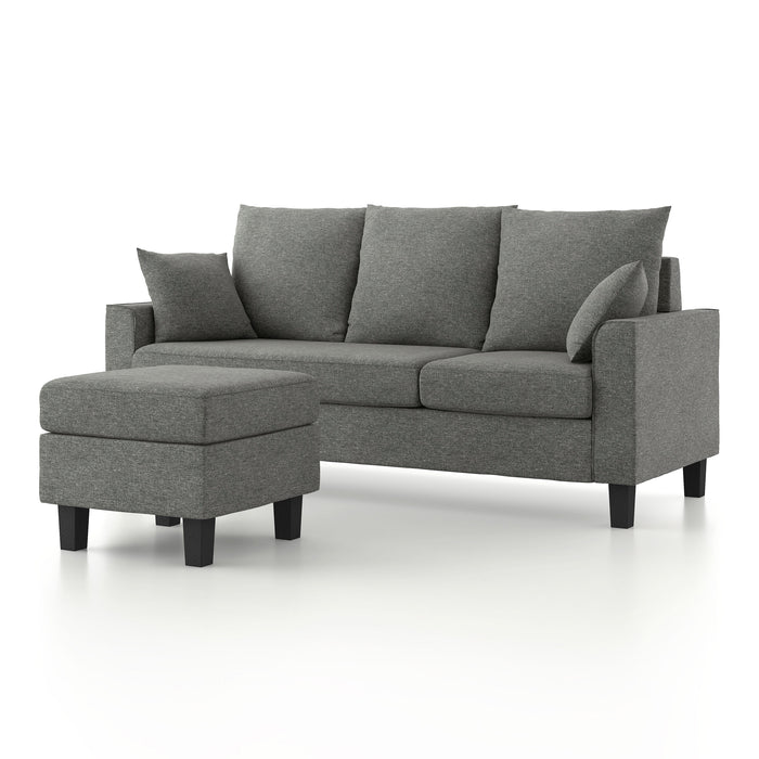 Left facing contemporary grey sectional sofa with an adjustable ottoman on a white background