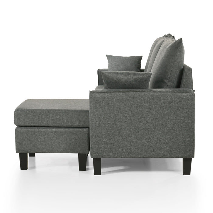 Front facing side view of a contemporary grey sectional sofa with an adjustable ottoman on a white background