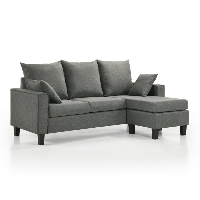 Right facing contemporary grey sectional sofa with an adjustable ottoman on a white background