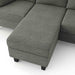 Close up view of the moveable ottoman of a contemporary grey sectional sofa with an adjustable ottoman on a white background