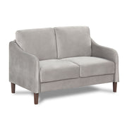 Right facing modern grey velvet loveseat with sloping arms on a white background
