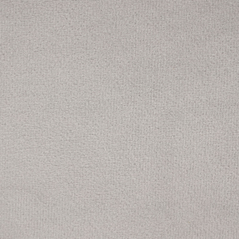 Swatch of the upholstery fabric of a modern grey velvet loveseat with sloping arms
