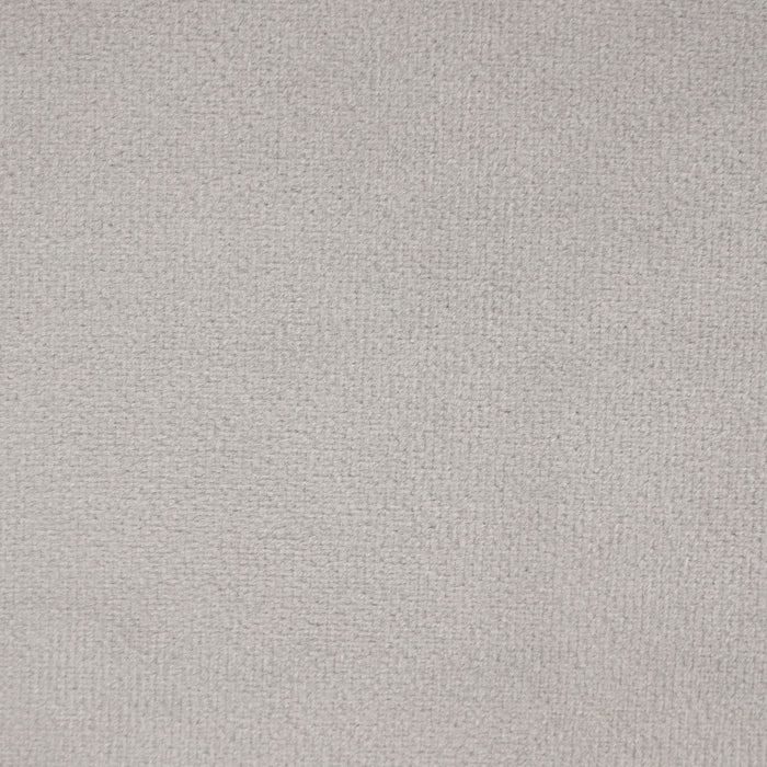 Swatch of the upholstery fabric of a modern grey velvet loveseat with sloping arms